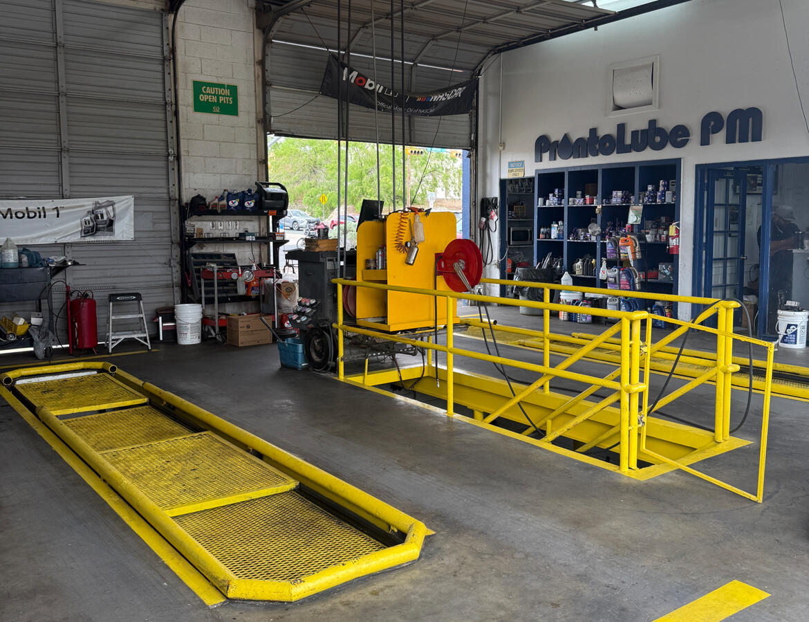Oil change and service bays inside J&A Lube in El Paso, TX.
